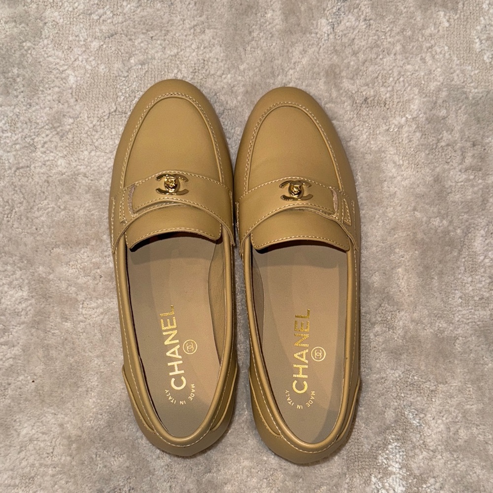 CHANEL Beige Loafers with Gold Emblem